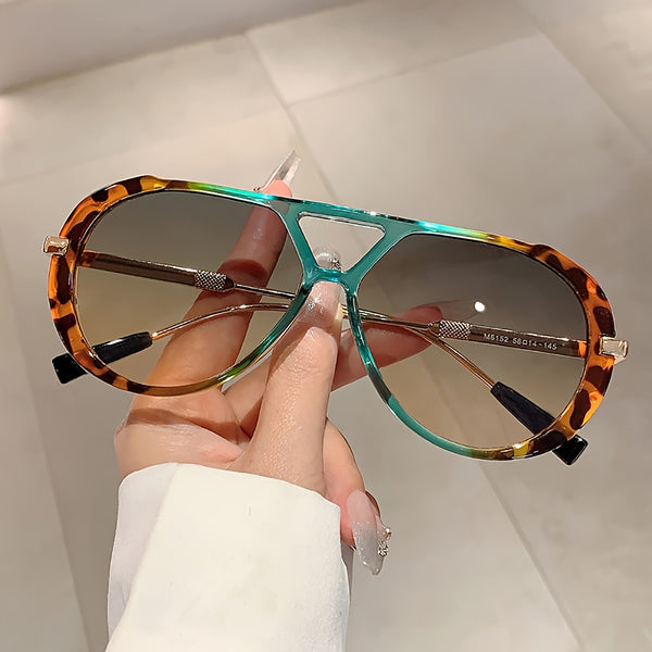 Women's round double-bridge fashion glasses — side view on stand