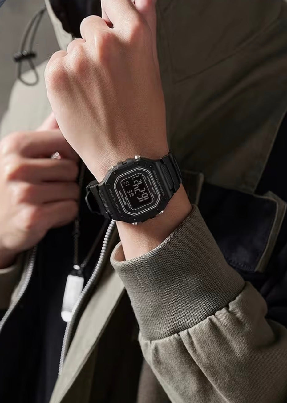 Model 2156J black digital watch worn on a wrist